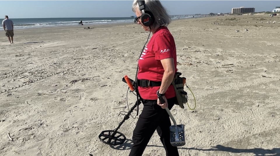 Nancy Keaton beach detecting with Minelab X-Terra Pro (Josh Keaton photo)