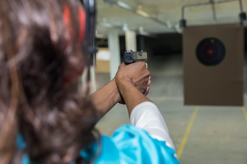 Woman Taking Aim on a Target (NSSF photo)