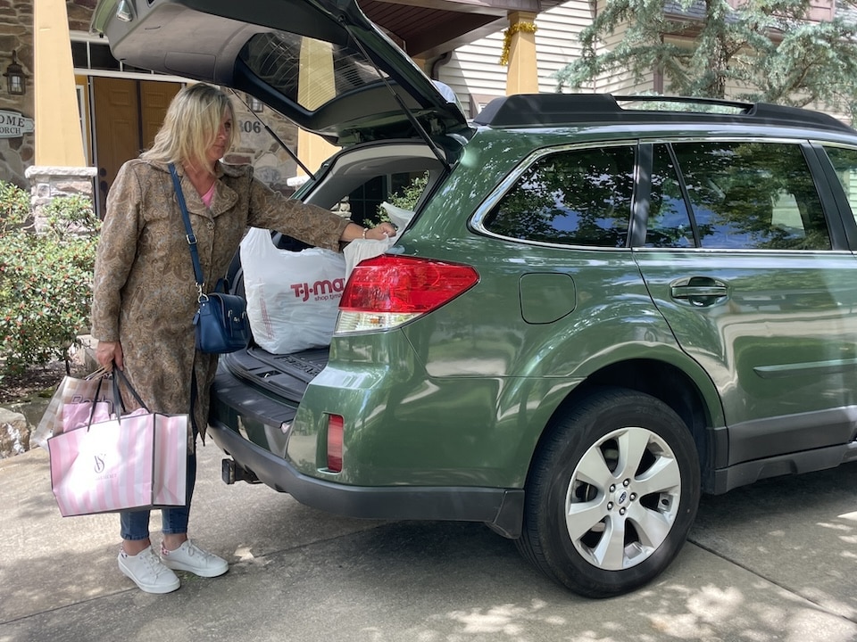 Taking packages out of car purse