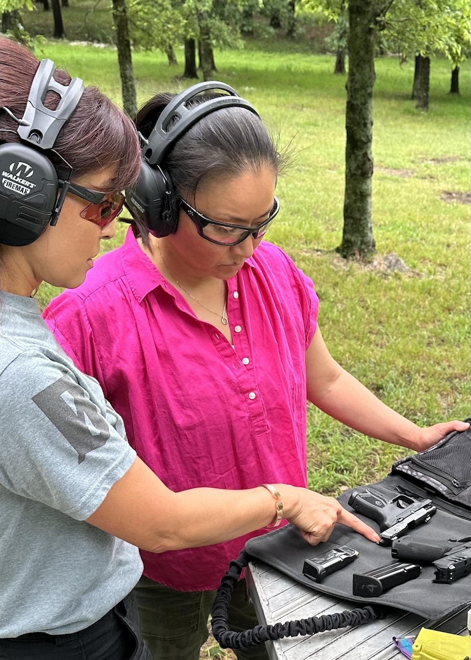 pointing at guns get her out to the gun range