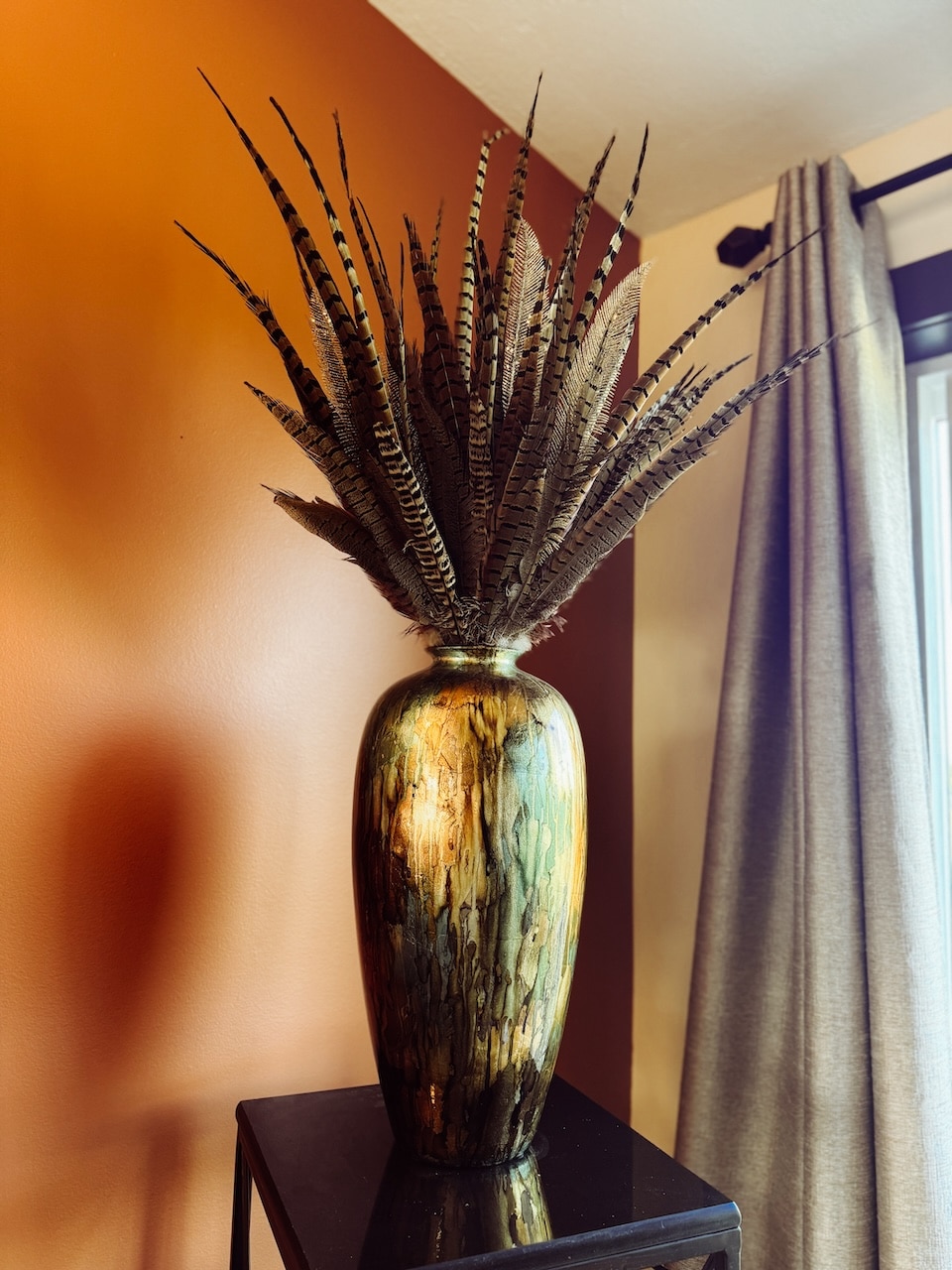 Pheasant feathers in vase