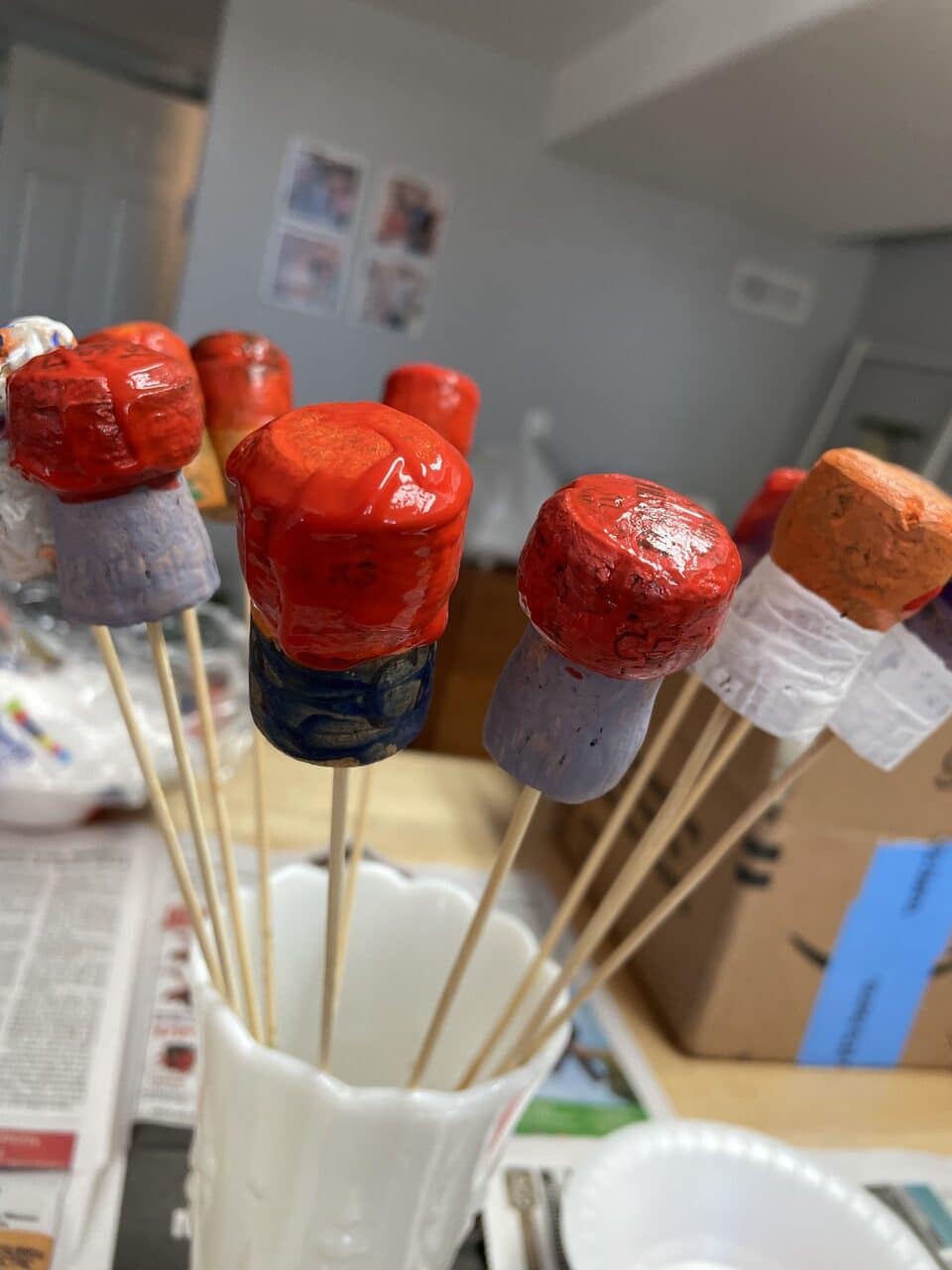 painted cork mushrooms in vase