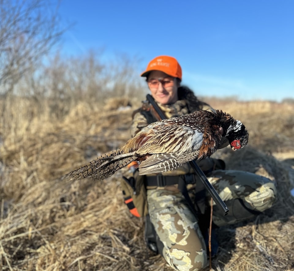 woman hunter with pheasnt