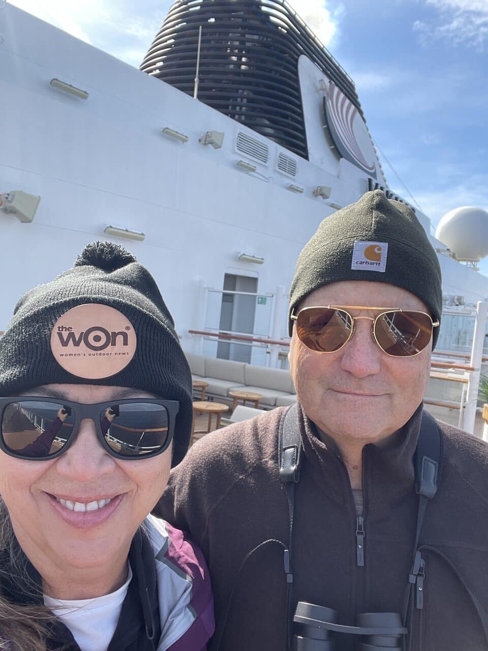 Babbs and the Bomb onboard in late June with stocking caps cruising alaska