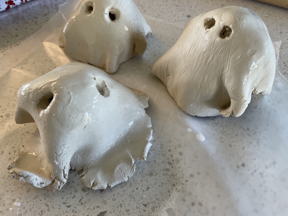 Three wet clay ghosts