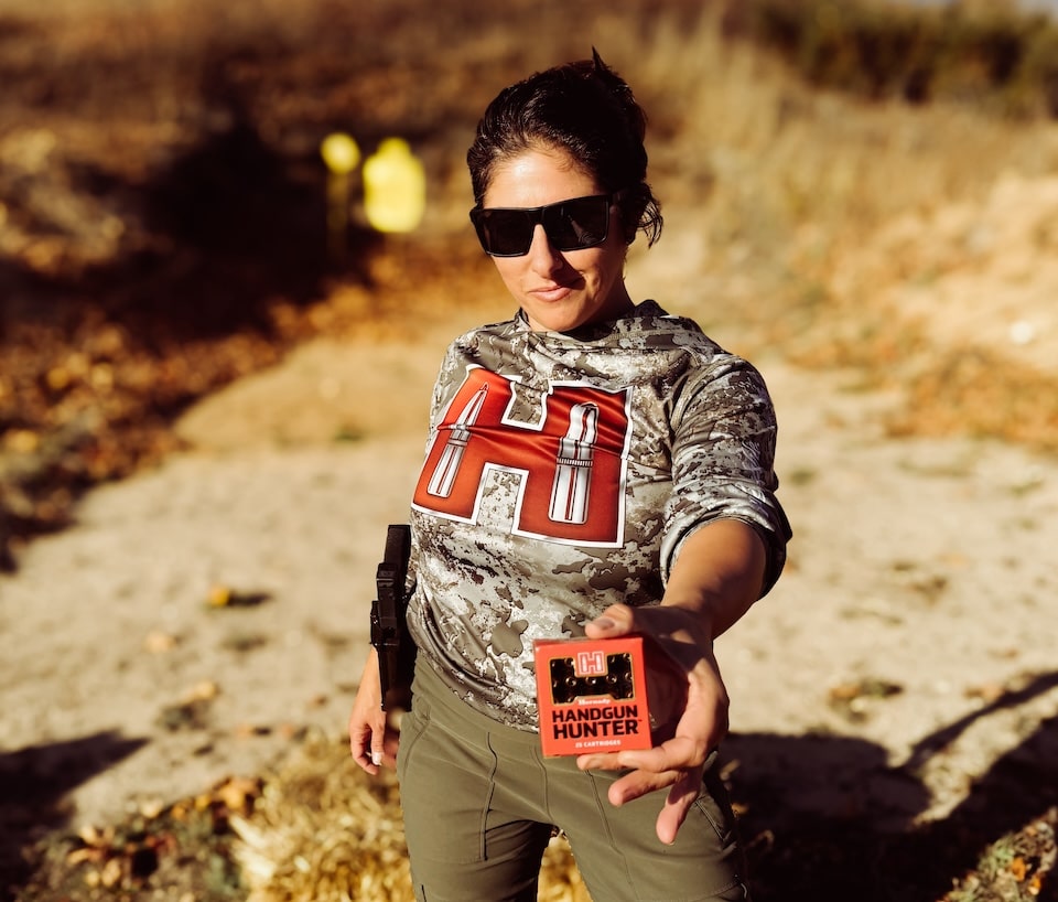 Woman holding Hornady ammo