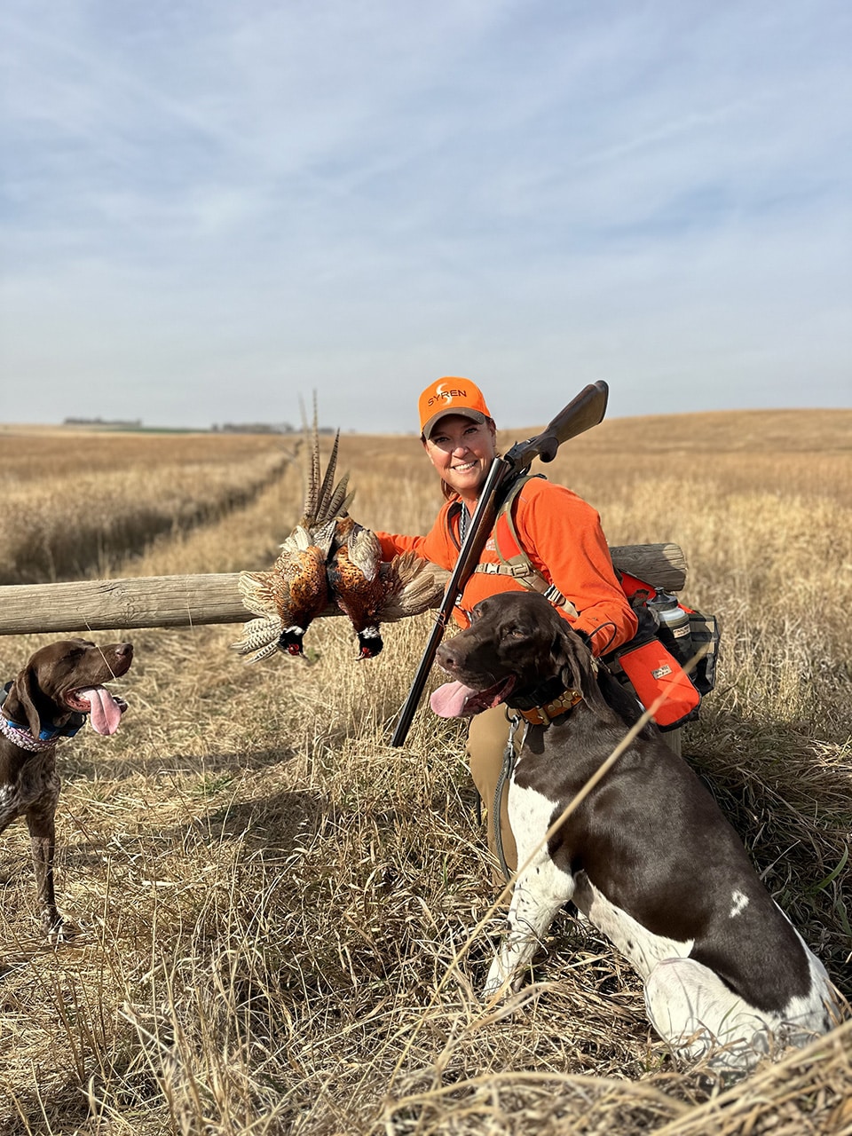 Kate with dogs and pheasants