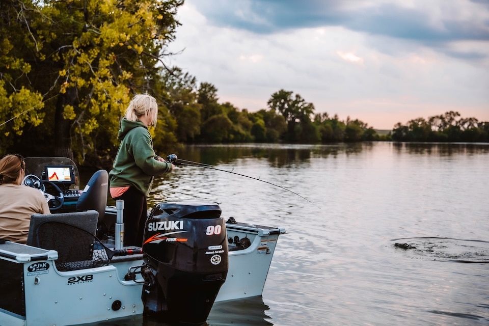 Woman reeling rom boat