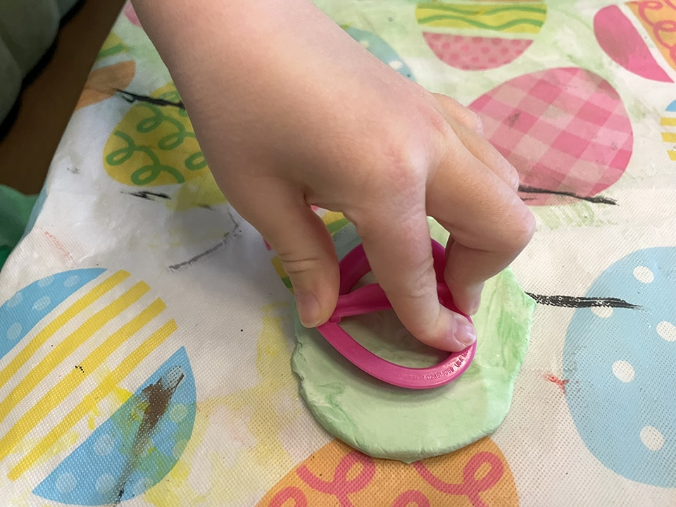 Cutting out the clay conversation hearts