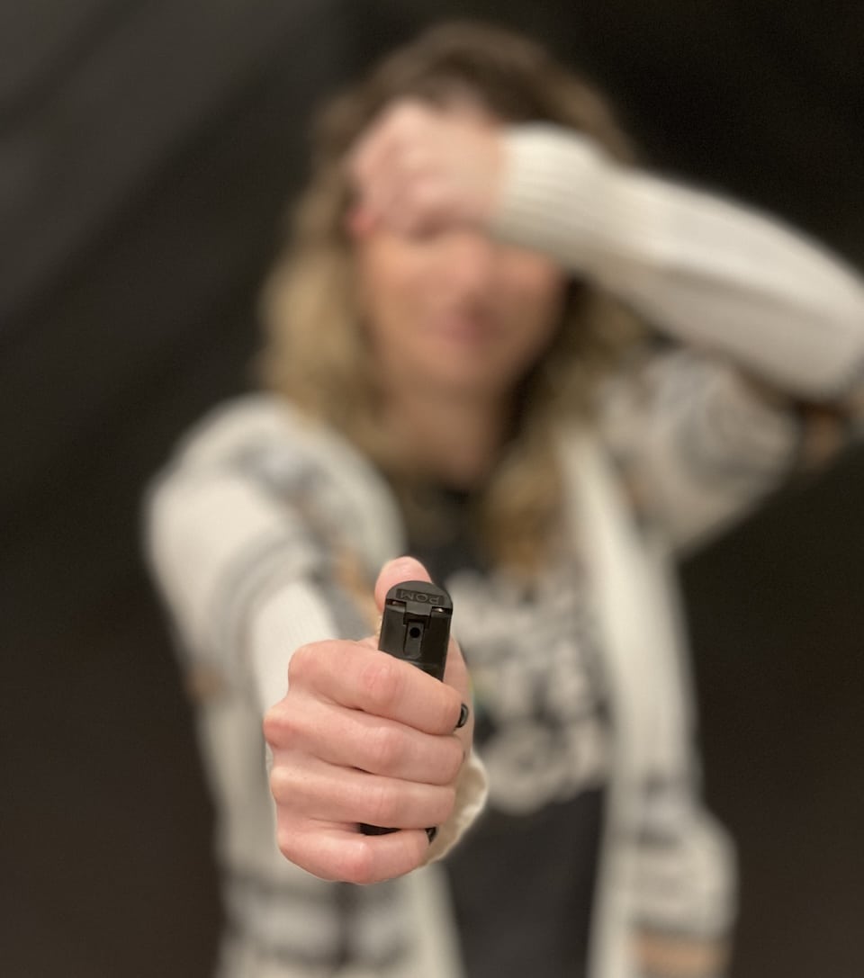 closeup woman with pepper spray